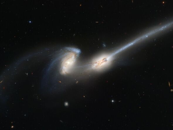 Cosmic Connection: Hubble’s New Image Illuminates the Bridge in Galactic Merger In the vast expanse of the cosmos, galaxies dance to the ancient choreography of gravitational forces. An enthralling celestial spectacle has recently been revealed through the lens of the Hubble Space Telescope – a galactic merger, capturing a bridge that connects these cosmic behemoths. This article unveils the beauty and significance of this cosmic connection, interpreting the recent imagery from Hubble and exploring the marvels of galactic mergers.  Unveiling the Mystery: Hubble’s Spectacular Capture In the heart of the universe, where the darkness of space meets the dance of stars, a new cosmic tale is unfolding. The Hubble Space Telescope, NASA’s astronomical marvel, has recently focused its lens on a celestial event of immense proportions – a galactic merger. This captivating image showcases a bridge of stellar matter that unites two galaxies in a breathtaking embrace, forever altering their trajectories.  Meet NASA: Pioneering the Frontier of Space Exploration Before delving into the cosmic connection captured by Hubble, let’s acquaint ourselves with the marvel that is NASA. The National Aeronautics and Space Administration (NASA) stands at the forefront of space exploration, research, and discovery. With a legacy dating back to its establishment in 1958, NASA has brought humanity groundbreaking insights into the cosmos, unraveling the mysteries of the universe. Its vast array of spacecraft and observatories, including the Hubble Space Telescope, have been instrumental in reshaping our understanding of the cosmos.  The Grand Dance of Galaxies: A Galactic Merger Unveiled Galactic mergers are a common phenomenon in the universe, where two or more galaxies gravitationally interact, leading to a stunning celestial dance. The recent image captured by the Hubble Space Telescope illustrates this phenomenon vividly, presenting two galaxies connected by a bridge of gas and stars.  Understanding the Dynamics When galaxies draw near due to gravitational forces, their structures are profoundly affected. The immense gravitational pull between them results in a gravitational dance, altering their shapes and forming bridges or tidal tails of stars, gas, and dust. These bridges are a testament to the raw power and beauty of cosmic interactions.  The Birth of Stars Galactic mergers are not only visually captivating but also a fundamental mechanism for triggering the birth of new stars. The shockwaves and compression of gas and dust caused by the collision create the perfect conditions for stellar nurseries, where stars are born, adding to the richness and diversity of our universe.  Decoding the Hubble Image: A Bridge to Cosmic Enlightenment The Hubble Space Telescope’s recent image of a galactic merger is a masterpiece of cosmic photography, offering a window into the dynamics of these celestial phenomena.  The Bridge Unveiled In this image, we witness the awe-inspiring bridge of gas and stars that connects the merging galaxies. This bridge, a product of gravitational forces and interactions, is a visual representation of the deep-seated connections that bind celestial bodies in the vastness of space.  Clues to the Past and Future Studying this bridge provides astronomers with valuable insights into the history and future of these galaxies. It offers a glimpse into their past trajectories and the impact of their encounter, allowing scientists to model and understand the dynamics of the merger and its far-reaching consequences.  The Beauty of Understanding: Awe-Inspiring Cosmic Realities The captivating imagery captured by Hubble, showcasing the bridge in a galactic merger, beckons us to ponder upon the grandeur of the cosmos. It reminds us that even in the vastness of space, connections and unions shape the celestial stage. This revelation invites us to contemplate our place in this awe-inspiring cosmic dance.  Conclusion: A Bridge to Infinite Possibilities In the silent theater of the cosmos, galaxies waltz through the eons, forming bridges and connections in their majestic mergers. The recent image captured by the Hubble Space Telescope illuminates a cosmic bridge, inviting us to witness this celestial ballet. Through the lens of NASA’s Hubble, we glimpse the intricate beauty of these galactic unions, and in doing so, we deepen our understanding of the universe’s ever-changing tapestry.