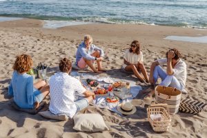 Friends Having Picnic on the Beach